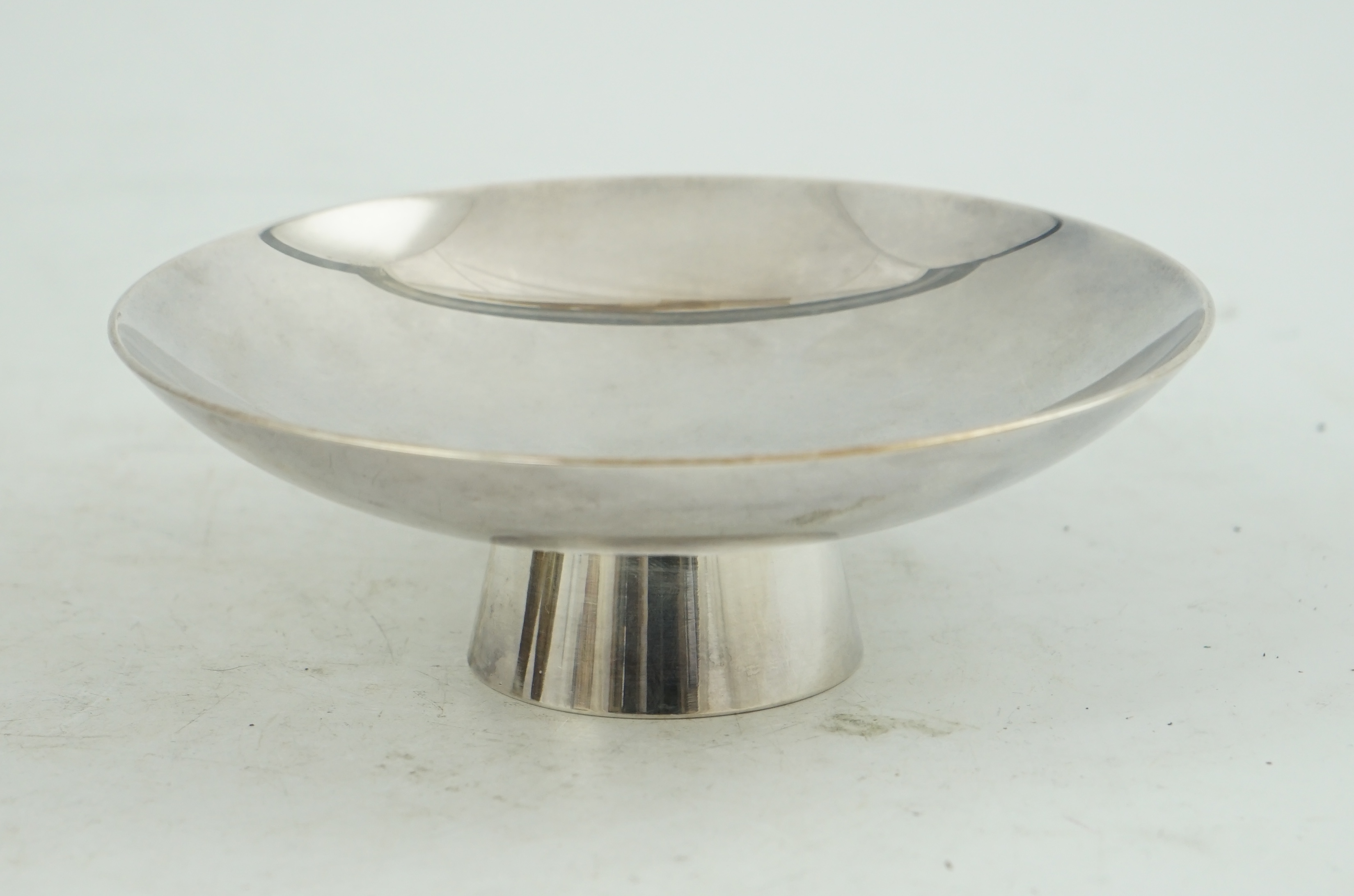 A heavy Japanese silver stem dish, early 20th century, stamped mark ‘jungin’ (pure silver)